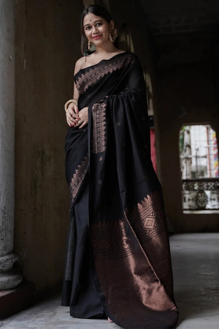 Energetic Black Soft Silk Saree With Delightful Blouse Piece