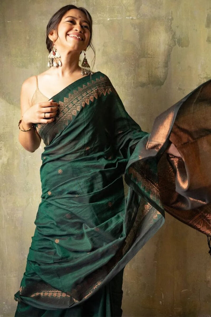 Opulent Dark Green Soft Silk Saree With Flameboyant Blouse Piece