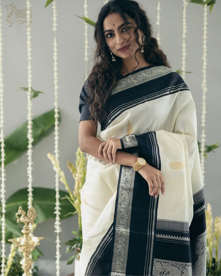 Adorable Off White Soft Silk Saree With Flameboyant Blouse Piece