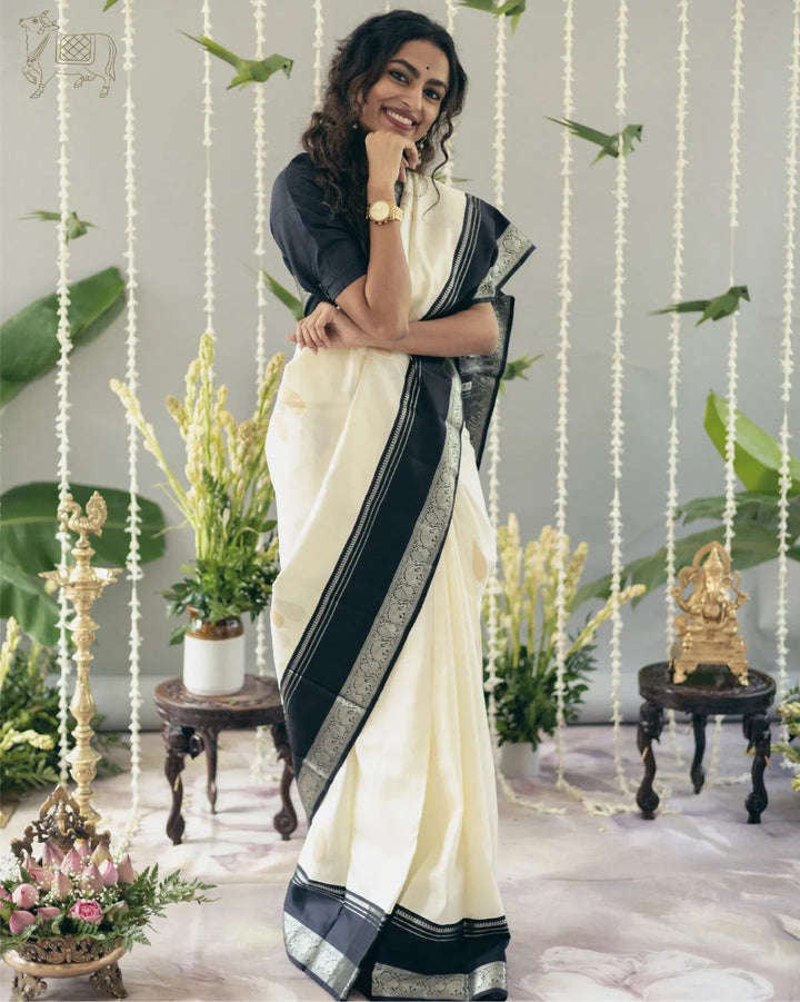 Adorable Off White Soft Silk Saree With Flameboyant Blouse Piece