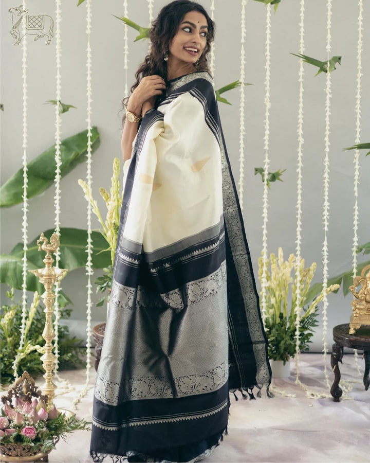 Adorable Off White Soft Silk Saree With Flameboyant Blouse Piece