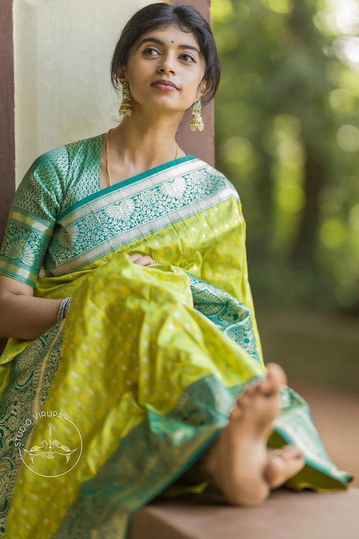 Gratifying Parrot Soft Silk Saree With Elegant Blouse Piece