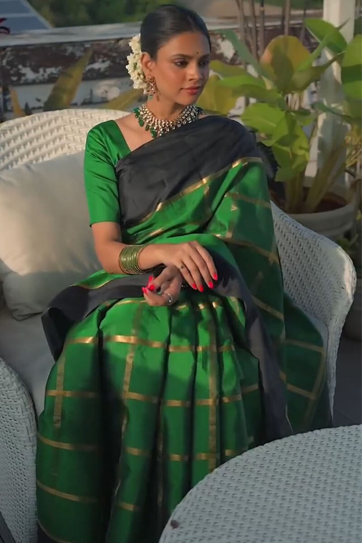 Alluring Dark Green Soft Silk Saree With Entrancing Blouse Piece