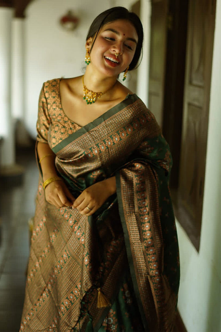 Captivating Green Soft Silk Saree With Twirling Blouse Piece