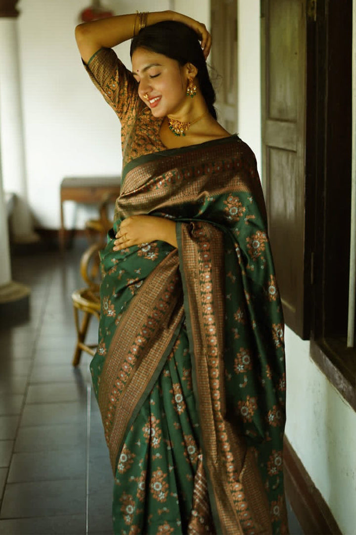 Captivating Green Soft Silk Saree With Twirling Blouse Piece