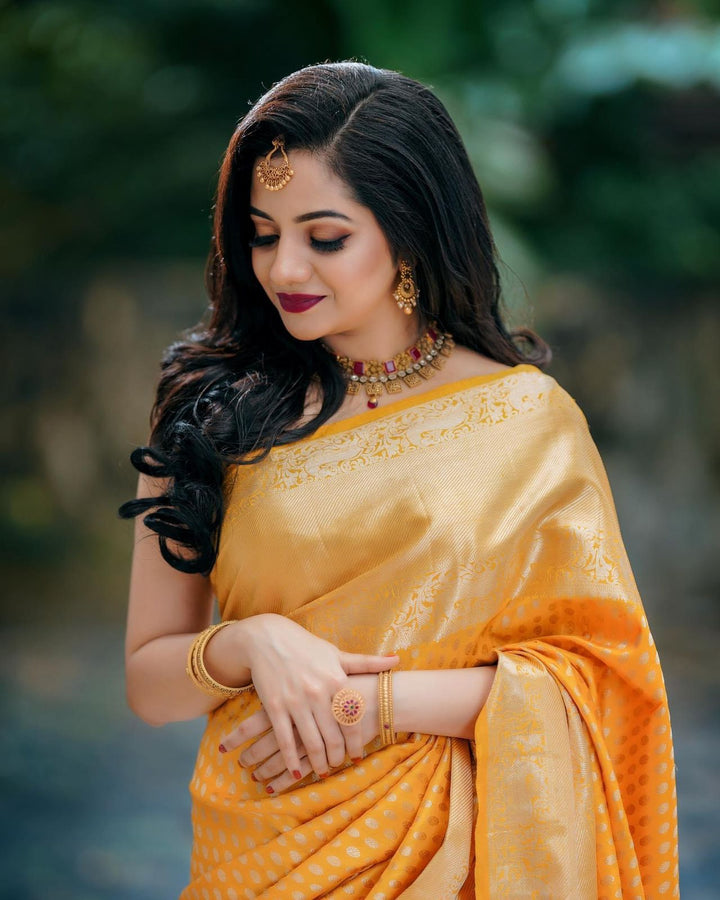 Ethnic Yellow Soft Banarasi Silk Saree With Breathtaking Blouse Piece