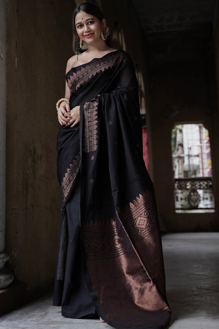 Entrancing Black Soft Silk Saree With Brood Blouse Piece