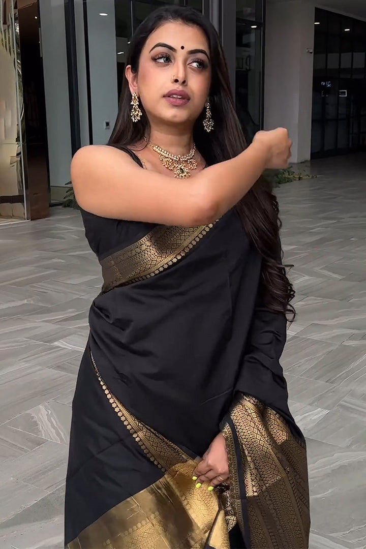 Appealing Black Soft Silk Saree With Prominent Blouse Piece