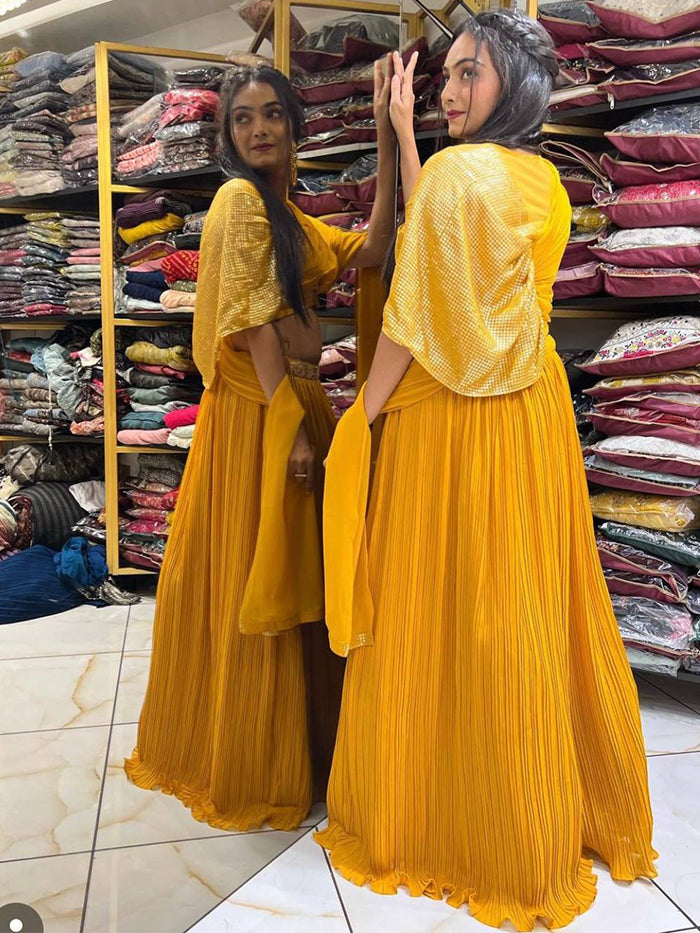 Yellow designer party wear look lehenga choli.